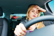 stock-photo-25096068-tired-girl-driving-a-car